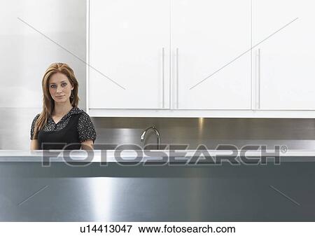 Woman in staff kitchen View Large Photo Image Stock Photo - Woman in staff kitchen. Fotosearch