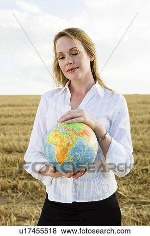 Woman with Globe in wheat field. View Large Photo Image Stock Photo - Woman with Globe in wheat field.. Fotosearch