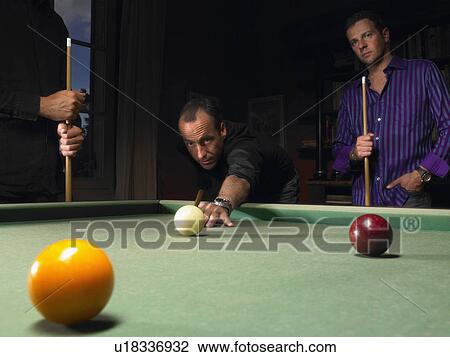 Stock Image - Men playing snooker. Fotosearch
