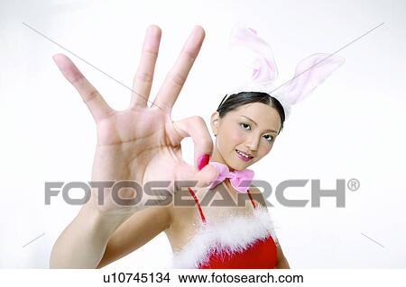 Picture - Asian Ethnicity, Close-Up, Bow, Agreement. Fotosearch