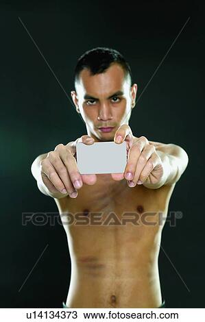 Stock Image - Bare Chest, Black Background, Asian Ethnicity. Fotosearch