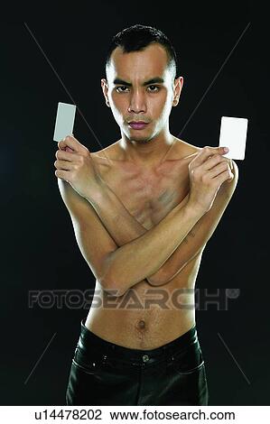 Stock Image - Bare Chest, Black Background, Asian Ethnicity. Fotosearch