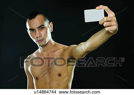 Bare Chest, Close-Up, Black Hair, Black Background, Asian Ethnicity View Large Photo Image Picture - Bare Chest, Close-Up, Black Hair, Black Background, Asian Ethnicity. Fotosearch