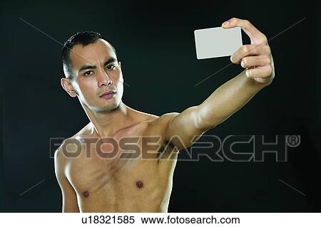 Stock Photography - Bare Chest, Placard, Show Card, Showing, Attitude, Black Hair. Fotosearch