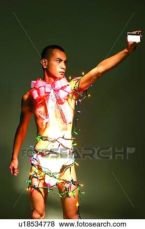 Stock Photo - Bizarre Fashion, Credit Card, Bow, Asian Ethnicity. Fotosearch