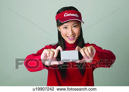 Stock Image - Black Hair, Close-Up, Casual Clothing, Cap, Asian Ethnicity. Fotosearch