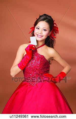 Stock Image - Black Hair, Colored Background, Close-Up, Asian Ethnicity. Fotosearch