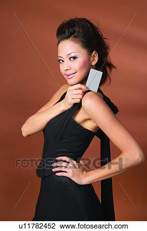 Black Hair, Colored Background, Close-Up, Asian Ethnicity View Large Photo Image Stock Image - Black Hair, Colored Background, Close-Up, Asian Ethnicity. Fotosearch