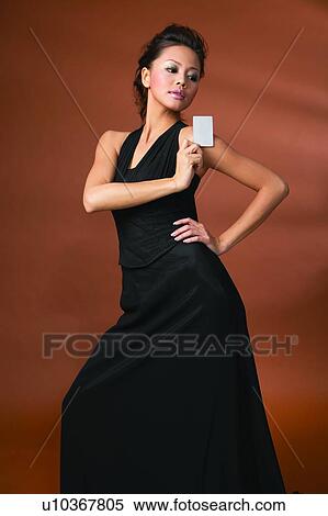 Stock Photography - Black Hair, Colored Background, Close-Up, Asian Ethnicity. Fotosearch
