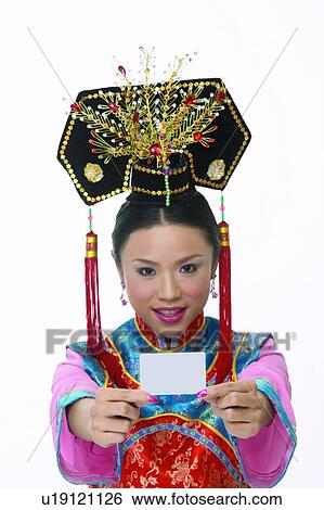 Stock Photograph - Black Hair, Earring, Close-Up, Asian Ethnicity. Fotosearch