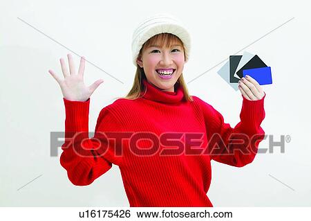 Stock Photograph - Brown Hair, Close-Up, Casual Clothing, Asian Ethnicity. Fotosearch