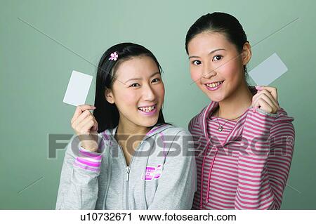 Stock Image - Casual Clothing, Ideas, Young Women, Toothy Smile, Waist-Up. Fotosearch