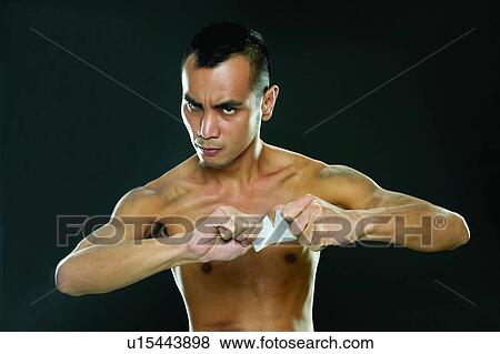 Close-Up, Bare Chest, Breaking, Black Hair, Black Background, Asian Ethnicity View Large Photo Image Stock Photo - Close-Up, Bare Chest, Breaking, Black Hair, Black Background, Asian Ethnicity. Fotosearch