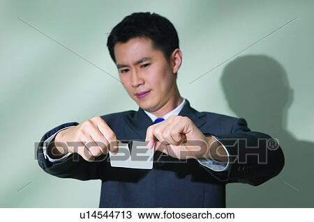 Stock Image - Close-Up, Black Hair, Businessman, Business Suit, Breaking, Asian Ethnicity. Fotosearch