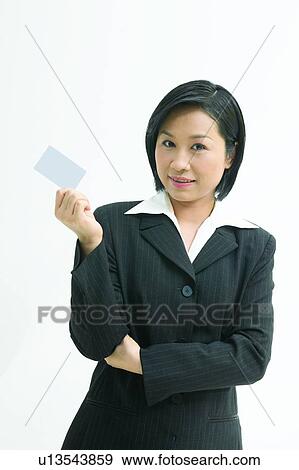Stock Photo - Communication, Asian Ethnicity, Business Suit, Formal Clothing, Looking At Camera. Fotosearch