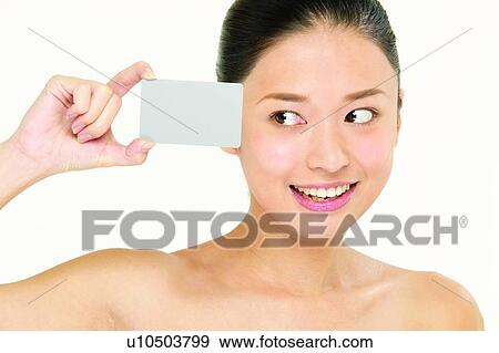 Stock Photo - Happiness, Semi-Dress, Indoor, Smiling, Looking Sideways, One Person, Showing. Fotosearch