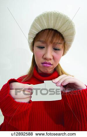 Indoor, Ideas, Long Hair, Anger, Show Card, Looking Down View Large Photo Image Stock Photo - Indoor, Ideas, Long Hair, Anger, Show Card, Looking Down. Fotosearch