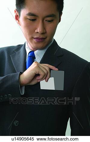 Stock Photography - Looking Down, Formal Clothing, Show Card, Attitude, Asian Ethnicity. Fotosearch