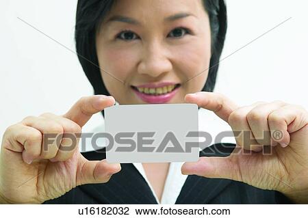 Stock Image - Portrait, Toothy Smile, Indoor, Businesswoman. Fotosearch