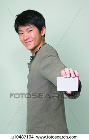 Picture - Smiling, One Person, Holding, Asian Ethnicity. Fotosearch