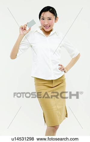 Stock Photo - Three-Quarter Length, Hand On Hip, Portrait, Toothy Smile, Asian Ethnicity. Fotosearch