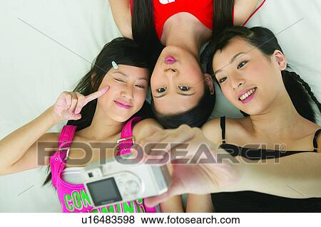 Stock Photo - Asian Ethnicity, Chinese Ethnicity, Casual Clothing, Black Hair, Adults Only. Fotosearch