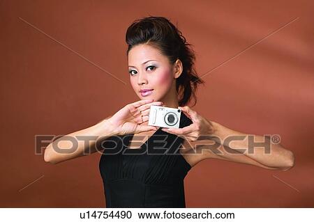 Black Hair, Posing, Show Tech, Asian Ethnicity, Photographing, Digital Camera View Large Photo Image Stock Image - Black Hair, Posing, Show Tech, Asian Ethnicity, Photographing, Digital Camera. Fotosearch