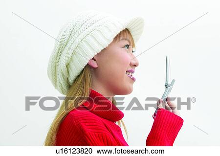 Casual Clothing, Head And Shoulders, Holding, Toothy Smile, Asian Ethnicity, Communication, Smiling View Large Photo Image Stock Image - Casual Clothing, Head And Shoulders, Holding, Toothy Smile, Asian Ethnicity, Communication, Smiling. Fotosearch