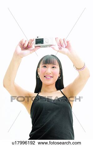 Chinese Ethnicity, Asian Ethnicity, Casual Clothing, Black Hair, Bangs, Arms Raised View Large Photo Image Stock Image - Chinese Ethnicity, Asian Ethnicity, Casual Clothing, Black Hair, Bangs, Arms Raised. Fotosearch