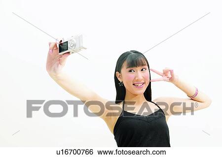 Chinese Ethnicity, Bangles, Casual Clothing, Black Hair, Bangs, Asian Ethnicity View Large Photo Image Stock Photograph - Chinese Ethnicity, Bangles, Casual Clothing, Black Hair, Bangs, Asian Ethnicity. Fotosearch