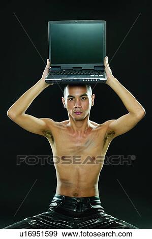Chinese Ethnicity, Indoor, Technology, Balance, One Young Man Only View Large Photo Image Stock Photo - Chinese Ethnicity, Indoor, Technology, Balance, One Young Man Only. Fotosearch