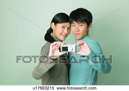 Happiness, Self Portrait Photography, Ponytail, Casual Clothing, Chinese Ethnicity, Posing View Large Photo Image Stock Photography - Happiness, Self Portrait Photography, Ponytail, Casual Clothing, Chinese Ethnicity, Posing. Fotosearch