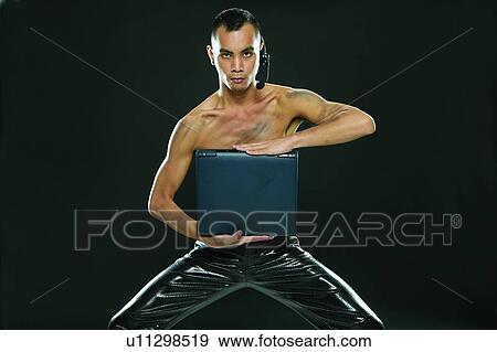 Legs Apart, Pants, Young Adult, Technology, Show Tech, Asian Ethnicity View Large Photo Image Stock Photo - Legs Apart, Pants, Young Adult, Technology, Show Tech, Asian Ethnicity. Fotosearch