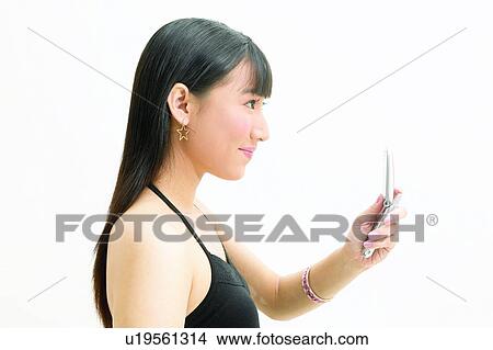 One Young Woman Only, Indoor, Casual Clothing, Eastern, Black Hair View Large Photo Image Picture - One Young Woman Only, Indoor, Casual Clothing, Eastern, Black Hair. Fotosearch