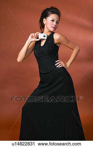 Stock Image - Showing, Posing, Three-Quarter Length, Hand On Hip, Show Tech. Fotosearch