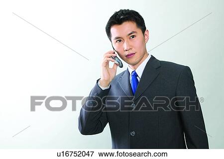 Wireless Technology, Asian Ethnicity, On The Phone, Connection View Large Photo Image Stock Photo - Wireless Technology, Asian Ethnicity, On The Phone, Connection. Fotosearch