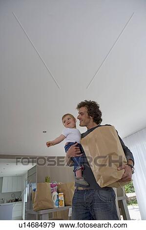 Happy father with baby, shopping View Large Photo Image Stock Photo - Happy father with baby, shopping. Fotosearch