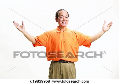 Stock Photo - Asian Ethnicity, Close-Up, Casual Clothing, Arms Raised. Fotosearch