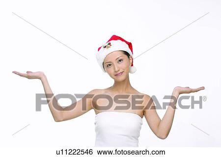 Stock Photograph - Asian Ethnicity, Close-Up, Casual Clothing, Arms Raised. Fotosearch