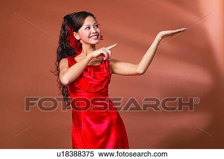 Asian Ethnicity, Close-Up, Casual Clothing, Black Hair, Arms Raised View Large Photo Image Stock Photography - Asian Ethnicity, Close-Up, Casual Clothing, Black Hair, Arms Raised. Fotosearch