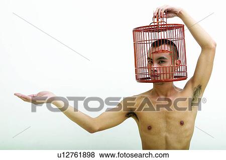 Bare Chest, Close-Up, Cage, Black Hair, Asian Ethnicity View Large Photo Image Stock Photo - Bare Chest, Close-Up, Cage, Black Hair, Asian Ethnicity. Fotosearch