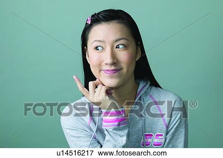 Stock Photo - Black Hair, Close-Up, Casual Clothing, Asian Ethnicity. Fotosearch