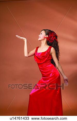 Stock Image - Black Hair, Communication, Colored Background, Asian Ethnicity. Fotosearch
