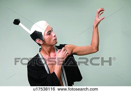Stock Photograph - Casual Clothing, Communication, Close-Up, Asian Ethnicity. Fotosearch