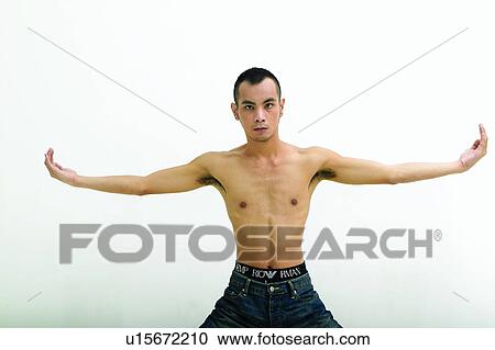 Stock Image - Close-Up, Arms Raised, Black Hair, Bare Chest, Asian Ethnicity, Arm Outstretched. Fotosearch