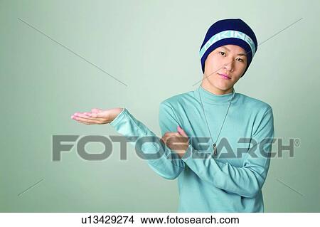 Close-Up, Colored Background, Asian Ethnicity, Standing, Spirit Signals View Large Photo Image Picture - Close-Up, Colored Background, Asian Ethnicity, Standing, Spirit Signals. Fotosearch