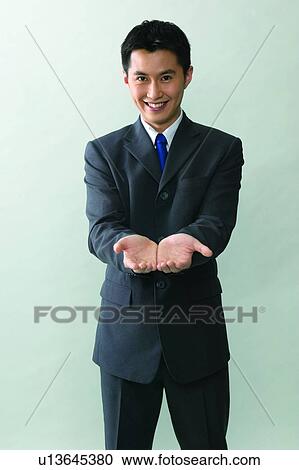 Stock Image - Close-Up, Communication, Businessman, Black Hair, Business, Formal Clothing. Fotosearch