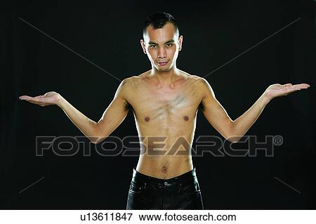 Close-Up, Looking At Camera, Asian Ethnicity, Portrait, Black Background, Posing View Large Photo Image Stock Photo - Close-Up, Looking At Camera, Asian Ethnicity, Portrait, Black Background, Posing. Fotosearch
