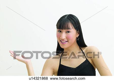 Communication, One Young Woman Only, Looking At Camera, Hand Raised, Head And Shoulders View Large Photo Image Stock Photo - Communication, One Young Woman Only, Looking At Camera, Hand Raised, Head And Shoulders. Fotosearch