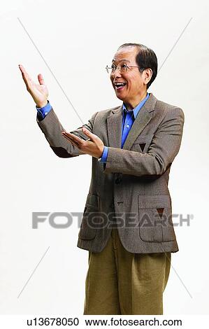 Gesturing, Toothy Smile, Full Suit, Communication, Smiling, Happiness View Large Photo Image Stock Image - Gesturing, Toothy Smile, Full Suit, Communication, Smiling, Happiness. Fotosearch